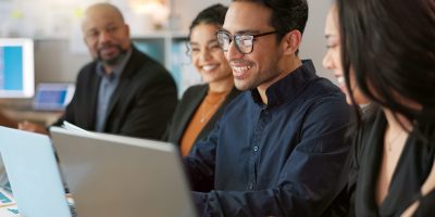 Man, presenter and collaboration with team in office for startup, strategy or business planning in .